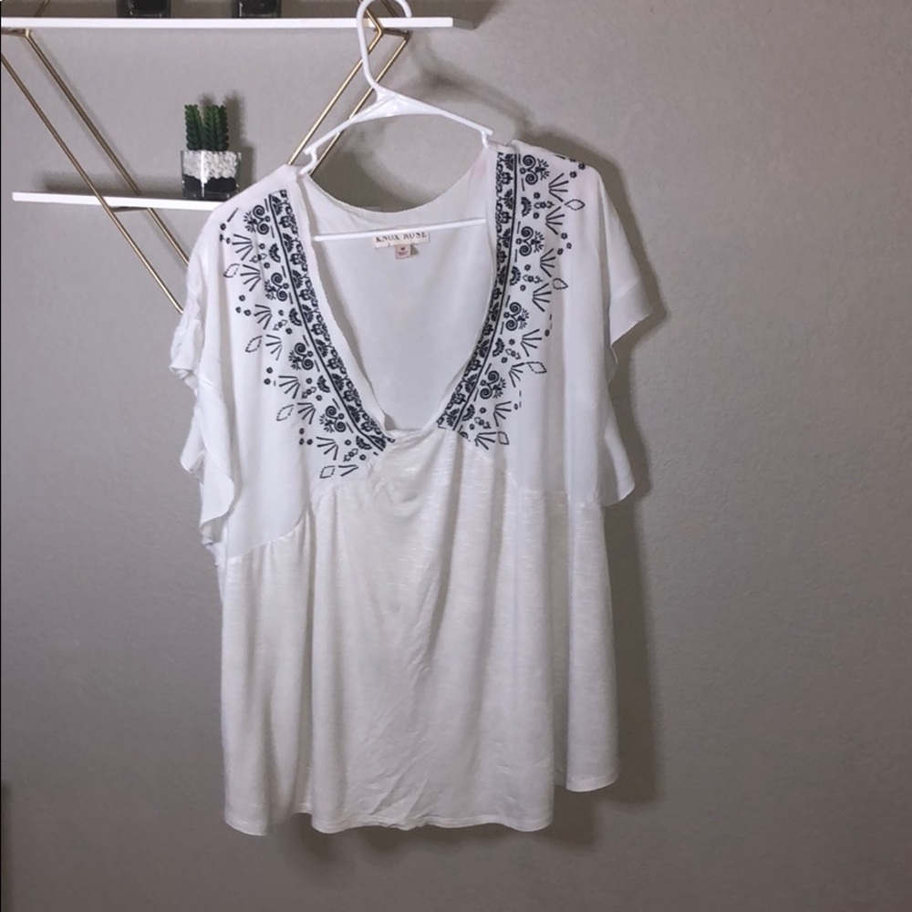 A white shirt with beautiful stitching